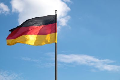 German flag waving against sky