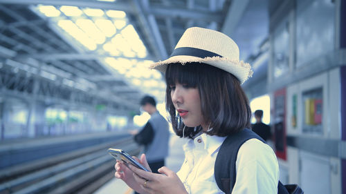 Portrait of young man using mobile phone