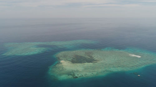 Seascape aerial view coral reef, atoll with turquoise water in atoll, coral reef in ocean waters. 