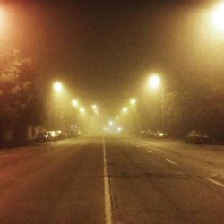 Illuminated street lights at night