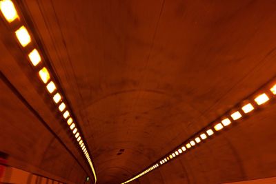 Low angle view of illuminated ceiling