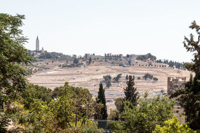 Hill against clear sky in town