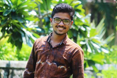 Portrait of young man standing outdoors