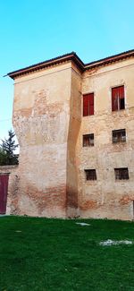 Low angle view of old building against sky