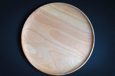 Directly above shot of wooden plate on table