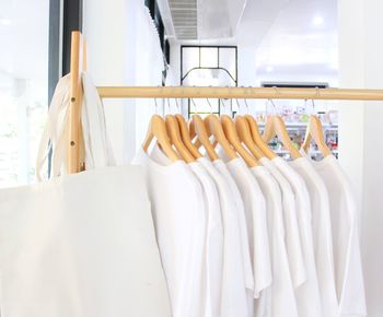 Close-up of clothes on rack at store