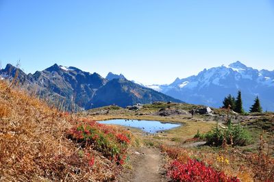 Scenic view of mountains against clear blue sky