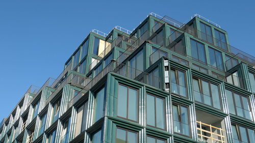 Low angle view of modern building against clear sky