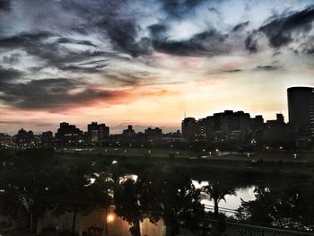 City against cloudy sky at dusk