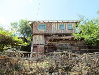 Low angle view of abandoned building against sky