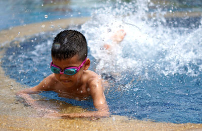 Portrait of boy in swimming pool