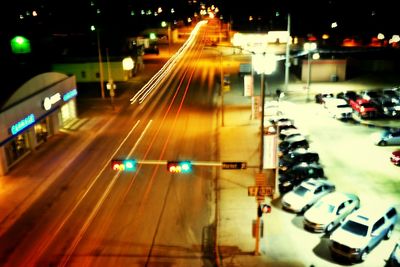 Illuminated city street at night