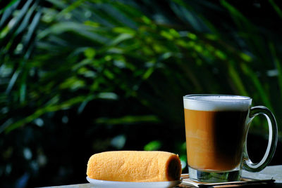 Close-up of coffee cup on table