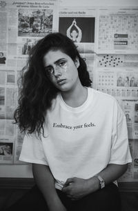 Portrait of beautiful young woman sitting at home