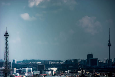 City skyline against cloudy sky