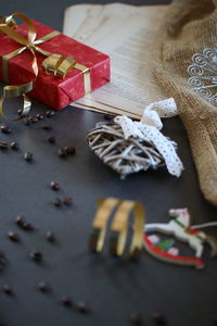 Chocolate chips by christmas decorations and gift box on table