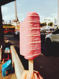 Close-up of hand holding ice cream cone