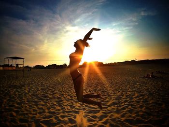 People on beach at sunset