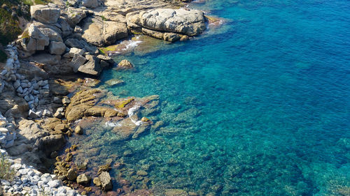 High angle view of rock formation in sea