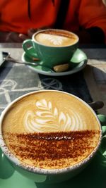 Close-up of cappuccino on table