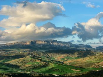 Aerial view of landscape against cloudy sky