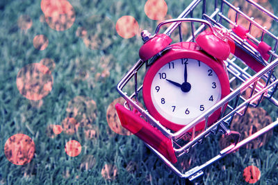 Close-up of alarm clock in shopping cart 