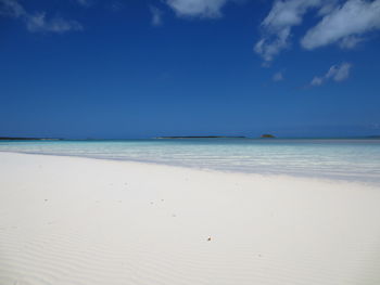 View of beach against blue sky