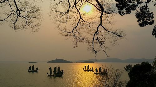 Scenic view of lake against cloudy sky