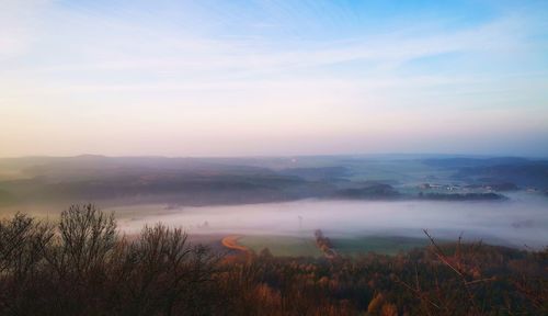 Scenic view of landscape against sky during sunset