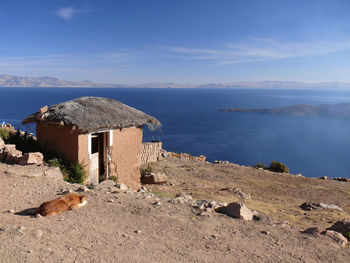 Scenic view of sea and mountains against sky