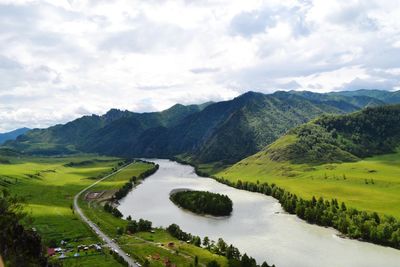 Scenic view of landscape and mountains against sky