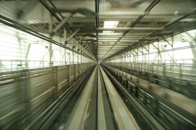 Blurred motion of railroad tracks at station