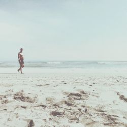 Full length of man on beach against sky