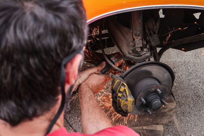 Rear view of man working in bus