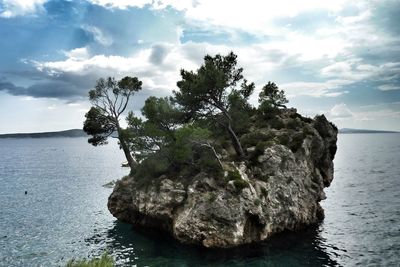 Scenic view of sea against cloudy sky