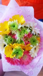 Close-up of multi colored flowers in vase