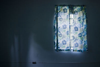 Close-up of curtain on window at home