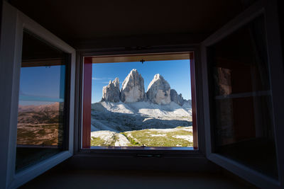 View of mountains through window