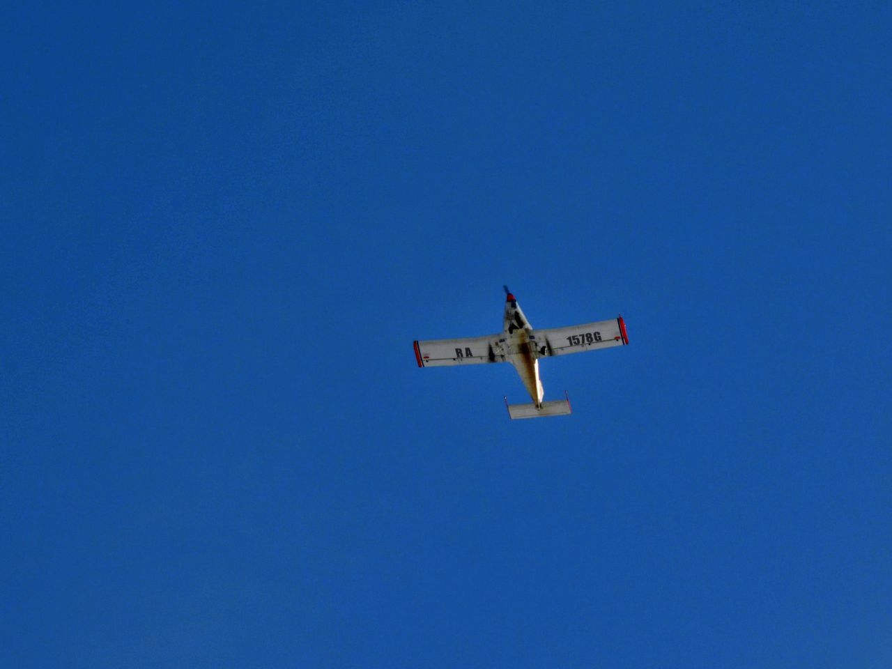 air vehicle, airplane, flying, sky, transportation, blue, mode of transportation, clear sky, on the move, low angle view, no people, travel, nature, mid-air, motion, aerobatics, aviation, day, copy space, vehicle, air travel, aircraft, air show, wing, outdoors, aerospace industry, sunny, air force, military, plane, journey