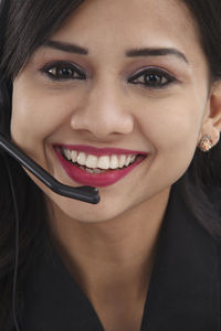 Close-up portrait of a smiling young woman