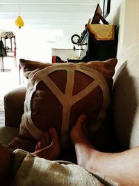 Low section of man wearing shoes