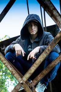 Portrait of young man sitting on boat