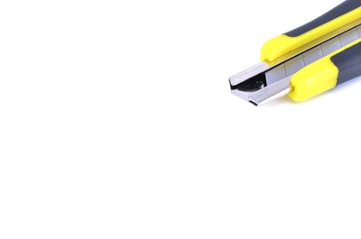 Close-up of yellow pencils over white background