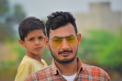 Portrait of smiling man wearing sunglasses