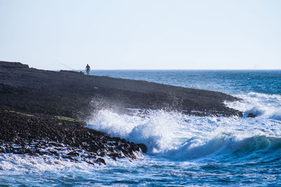 Scenic view of sea against clear sky