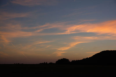 Scenic view of silhouette trees against sky during sunset