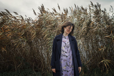 Full length of woman standing on field