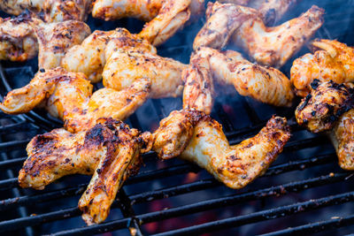 Close-up of meat on barbecue grill