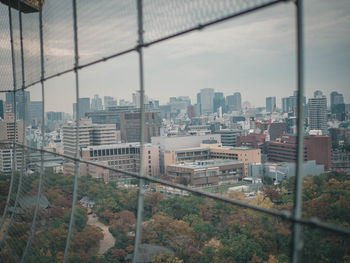 High angle view of buildings in city against sky