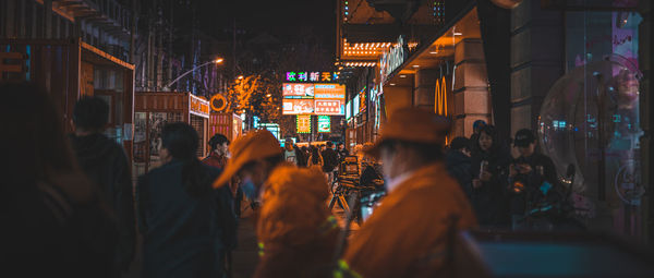 People walking on street at night